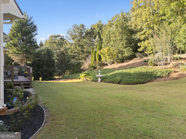 view of yard featuring a wooden deck