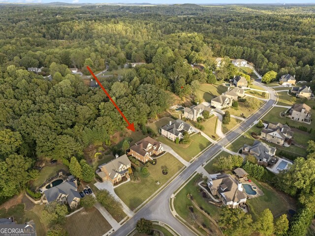 aerial view featuring a residential view and a view of trees