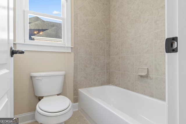 full bath featuring tile patterned floors, baseboards, and toilet