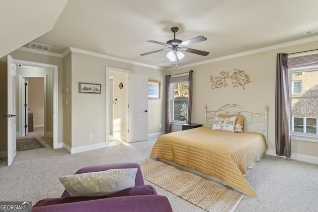bedroom with baseboards, visible vents, light colored carpet, and multiple windows