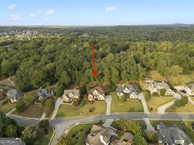 bird's eye view with a residential view and a view of trees