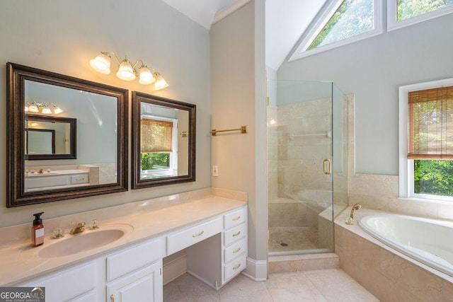 full bath with plenty of natural light, a stall shower, and a garden tub