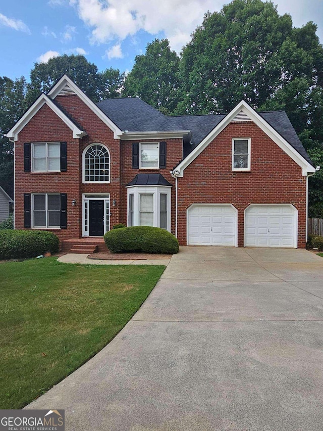 5114 Verbena Dr NW, Acworth, GA 30102 - colonial home with brick siding, a front lawn, driveway, and a garage