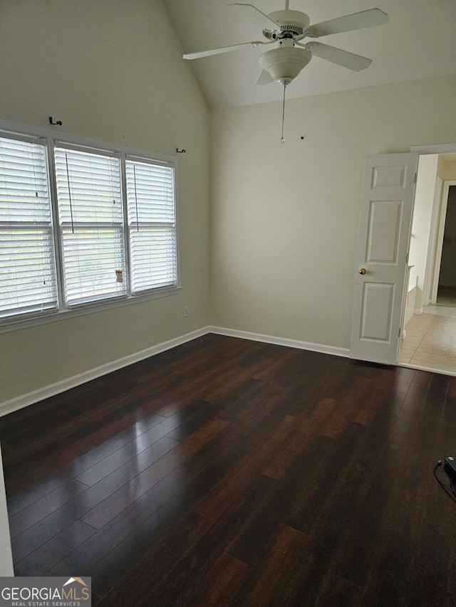 5114 Verbena Dr NW, Acworth, GA 30102 - unfurnished room featuring wood-type flooring, vaulted ceiling, ceiling fan, and baseboards