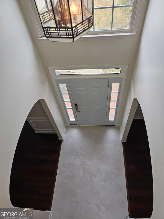5114 Verbena Dr NW, Acworth, GA 30102 - entrance foyer with a towering ceiling, baseboards, and arched walkways