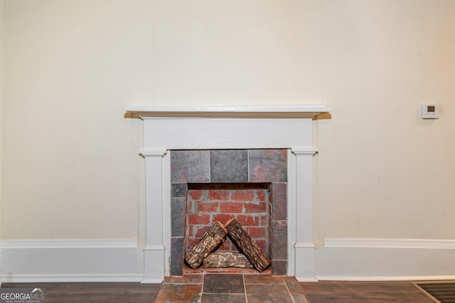 26 Walker St, Cartersville, GA 30120 - room details with a tiled fireplace and wood finished floors