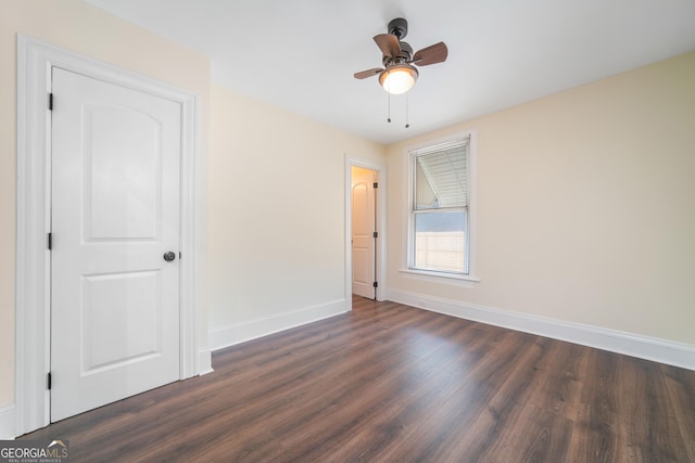 26 Walker St, Cartersville, GA 30120 - unfurnished bedroom with baseboards, ceiling fan, and dark wood-style flooring