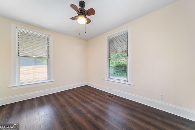 26 Walker St, Cartersville, GA 30120 - spare room with dark wood-style flooring, baseboards, visible vents, and a ceiling fan
