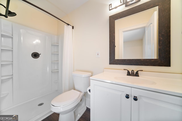 26 Walker St, Cartersville, GA 30120 - bathroom with vanity, curtained shower, toilet, and wood finished floors