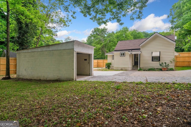 26 Walker St, Cartersville, GA 30120 - exterior space with a garage, fence, an outbuilding, and driveway