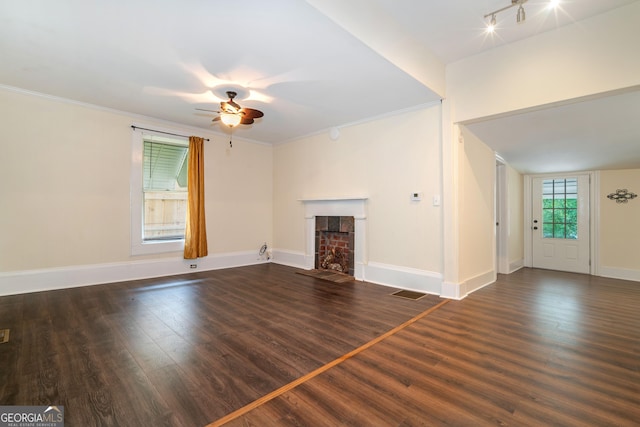 26 Walker St, Cartersville, GA 30120 - unfurnished living room featuring a ceiling fan, a fireplace with flush hearth, crown molding, wood finished floors, and baseboards
