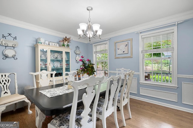57 Glenn Eagles Way, Hiram, GA 30141 - dining area featuring a chandelier, crown molding, wood finished floors, and baseboards