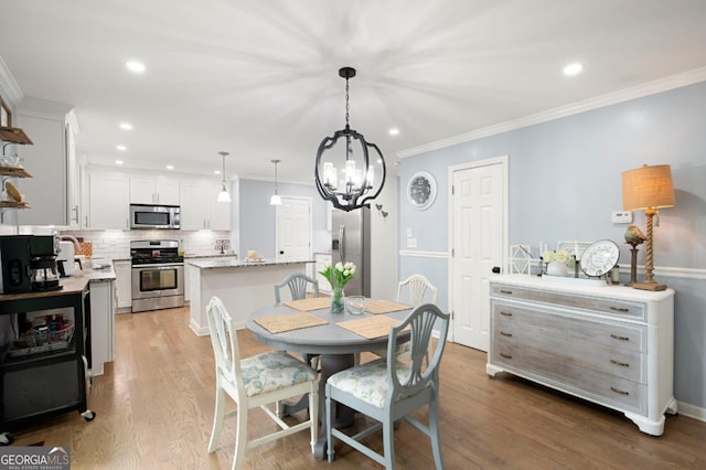 57 Glenn Eagles Way, Hiram, GA 30141 - dining room with a chandelier, recessed lighting, wood finished floors, and crown molding