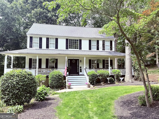 57 Glenn Eagles Way, Hiram, GA 30141 - colonial-style house featuring covered porch, a front yard, and roof with shingles