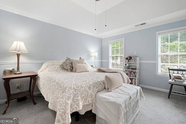 carpeted bedroom with crown molding and baseboards