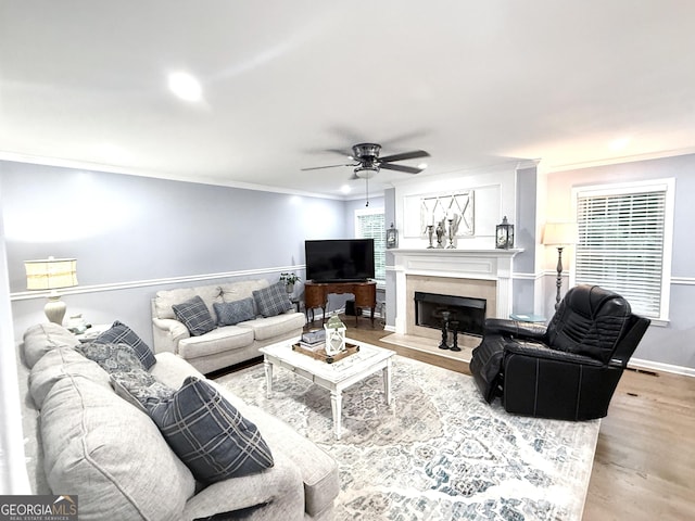 57 Glenn Eagles Way, Hiram, GA 30141 - living room with ornamental molding, a ceiling fan, wood finished floors, a premium fireplace, and recessed lighting