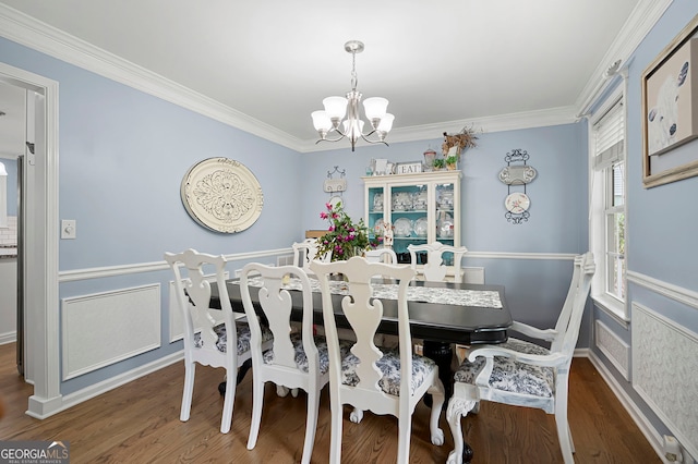 57 Glenn Eagles Way, Hiram, GA 30141 - dining room featuring a chandelier, ornamental molding, wood finished floors, and baseboards