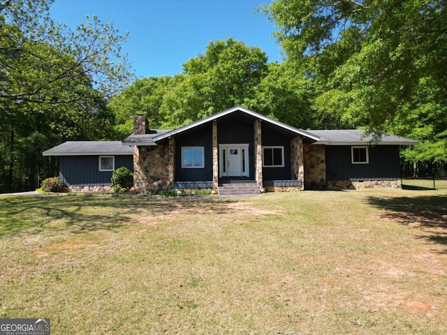 1961 Mars Hill Rd, Watkinsville, GA 30677 - view of front of house featuring board and batten siding, a chimney, and a front lawn