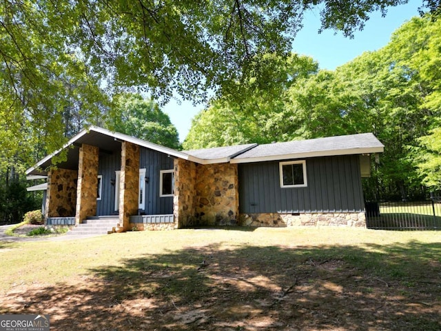 1961 Mars Hill Rd, Watkinsville, GA 30677 - view of front of property with board and batten siding, fence, and stone siding