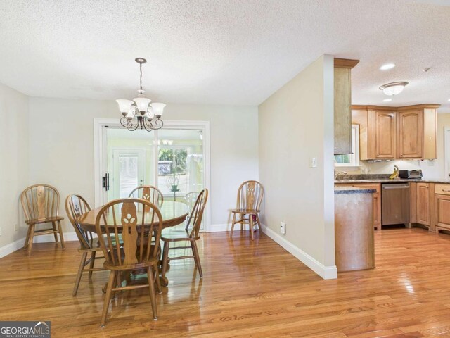 1961 Mars Hill Rd, Watkinsville, GA 30677 - dining area with light wood-style flooring, baseboards, an inviting chandelier, and a textured ceiling