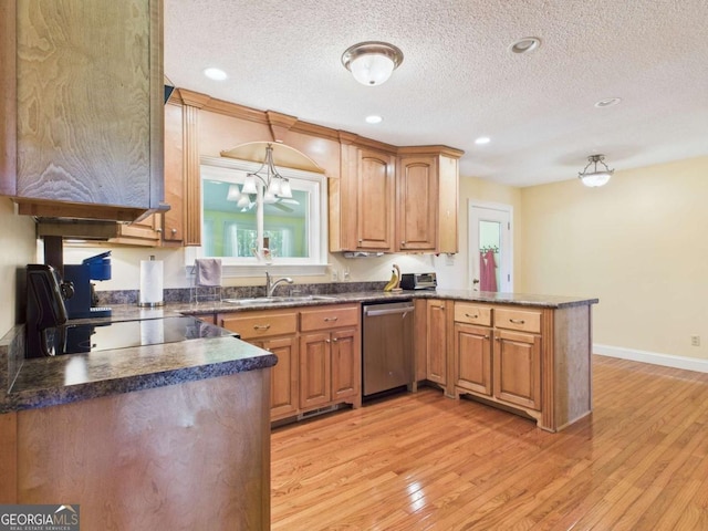 1961 Mars Hill Rd, Watkinsville, GA 30677 - kitchen with dark countertops, stainless steel dishwasher, a sink, light wood-type flooring, and a peninsula