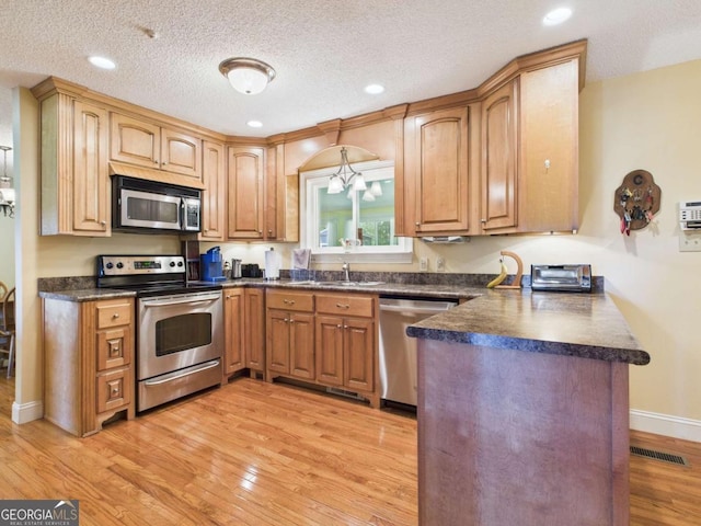 1961 Mars Hill Rd, Watkinsville, GA 30677 - kitchen featuring stainless steel appliances, a peninsula, a sink, and dark countertops