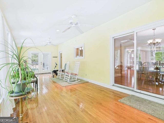 1961 Mars Hill Rd, Watkinsville, GA 30677 - interior space featuring light wood-style flooring, a healthy amount of sunlight, baseboards, and ceiling fan with notable chandelier
