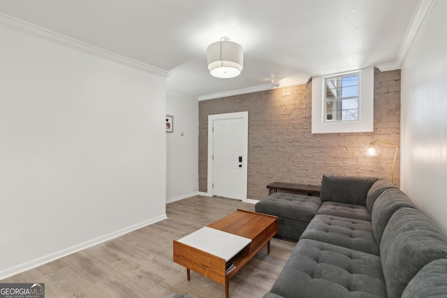 living room with baseboards, ornamental molding, and wood finished floors