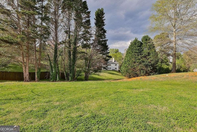 view of yard featuring fence