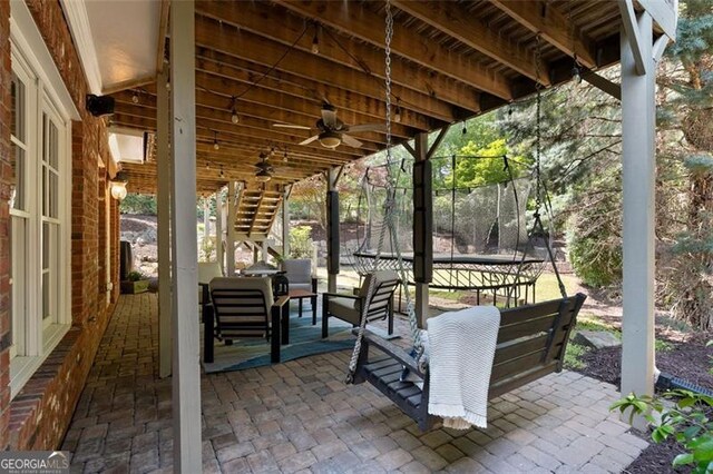 4675 Lakeway Pl, Alpharetta, GA 30005 - view of patio with ceiling fan, stairs, and a trampoline