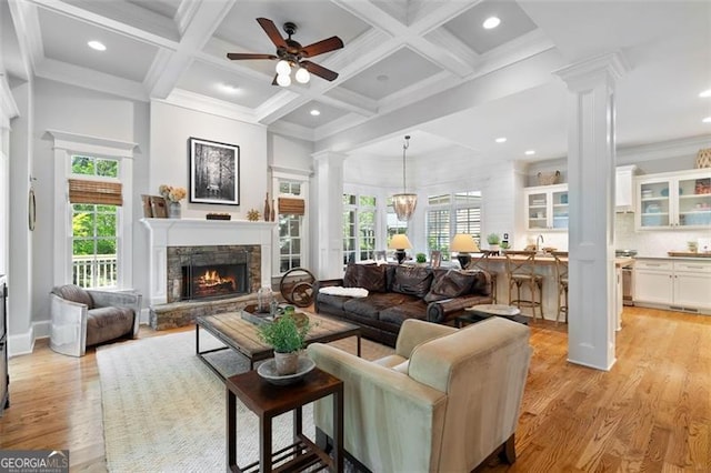 4675 Lakeway Pl, Alpharetta, GA 30005 - living room with recessed lighting, plenty of natural light, ornate columns, and beamed ceiling