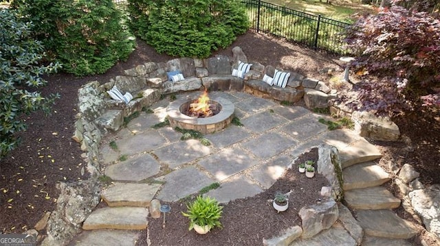 4675 Lakeway Pl, Alpharetta, GA 30005 - view of patio with an outdoor fire pit and fence