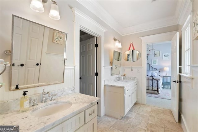4675 Lakeway Pl, Alpharetta, GA 30005 - full bath featuring wainscoting, two vanities, ornamental molding, and a sink