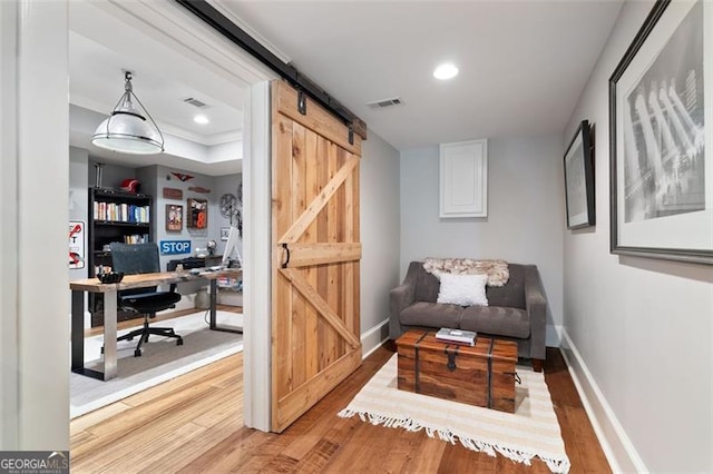 4675 Lakeway Pl, Alpharetta, GA 30005 - sitting room featuring baseboards, wood finished floors, visible vents, and a barn door