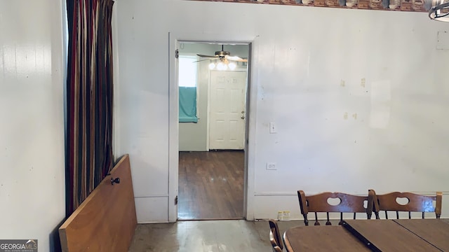 dining space featuring wood finished floors and a ceiling fan
