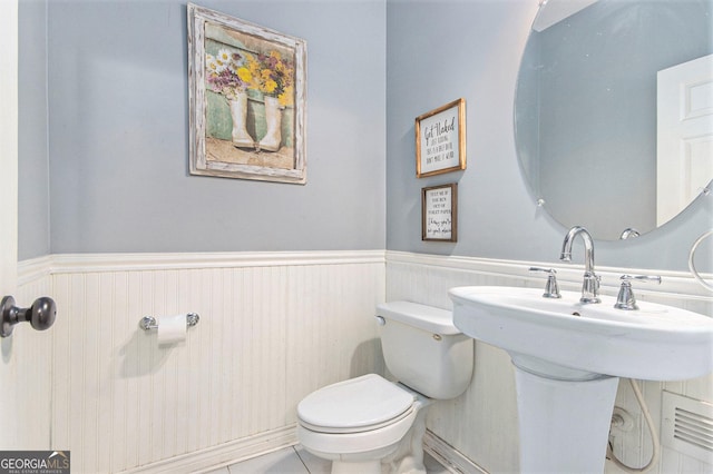 4440 Spring Mtn Ln, Powder Springs, GA 30127 - half bathroom with toilet and a wainscoted wall