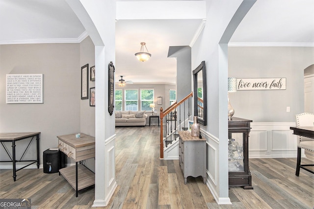 4440 Spring Mtn Ln, Powder Springs, GA 30127 - foyer with arched walkways, wood finished floors, crown molding, ceiling fan, and stairs
