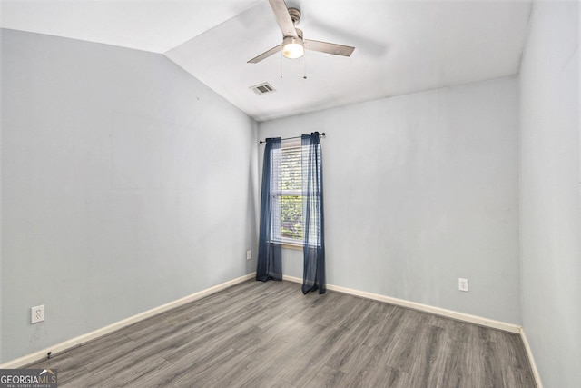 4440 Spring Mtn Ln, Powder Springs, GA 30127 - spare room with a ceiling fan, wood finished floors, and vaulted ceiling