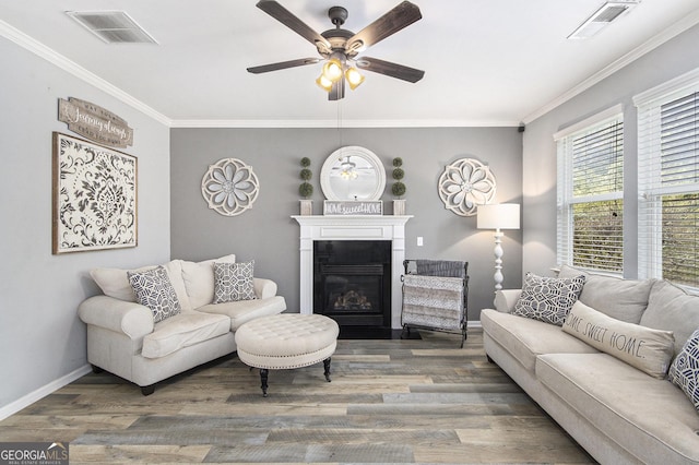 4440 Spring Mtn Ln, Powder Springs, GA 30127 - living area with ceiling fan, ornamental molding, wood finished floors, and a fireplace with flush hearth