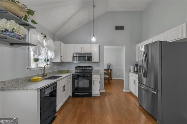 831 Kendall Park Dr, Winder, GA 30680 - kitchen featuring black appliances, a sink, high vaulted ceiling, white cabinetry, and dark wood-style flooring
