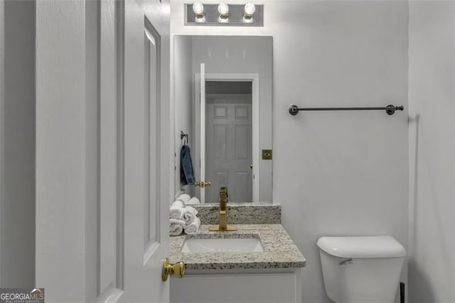 831 Kendall Park Dr, Winder, GA 30680 - half bathroom with toilet and vanity