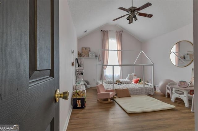 831 Kendall Park Dr, Winder, GA 30680 - bedroom with wood finished floors and vaulted ceiling