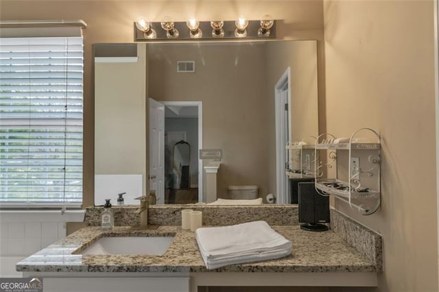 831 Kendall Park Dr, Winder, GA 30680 - bathroom featuring vanity and toilet