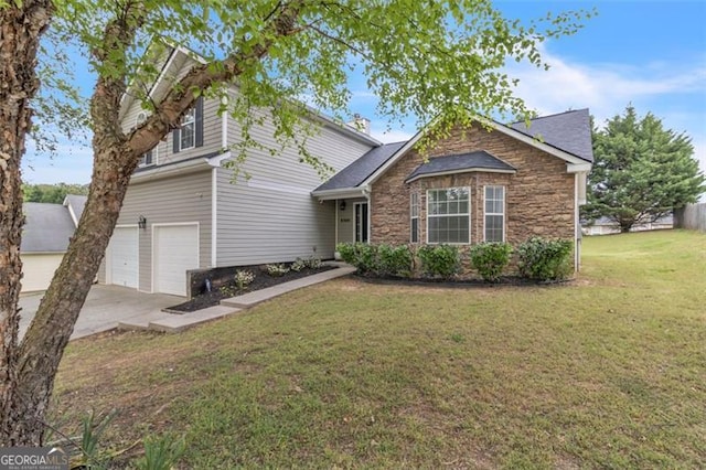 831 Kendall Park Dr, Winder, GA 30680 - traditional-style house featuring a garage, concrete driveway, a front yard, and stone siding