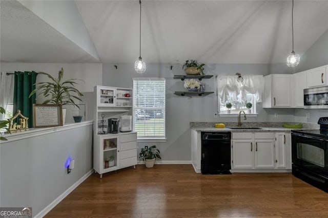 831 Kendall Park Dr, Winder, GA 30680 - kitchen with black appliances, a sink, lofted ceiling, dark wood-style flooring, and white cabinets