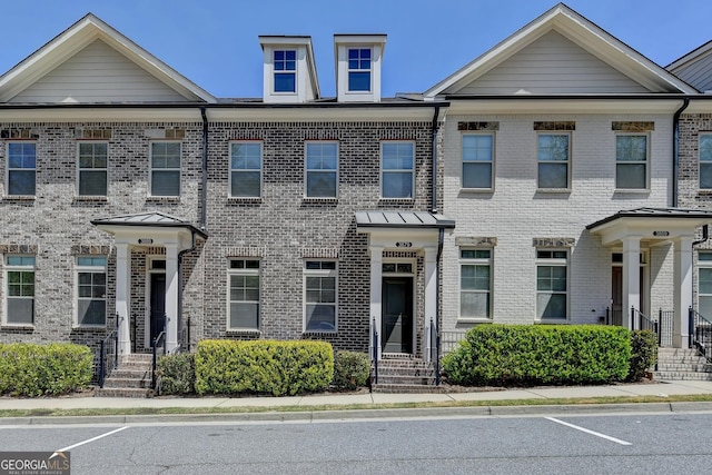 view of property with brick siding