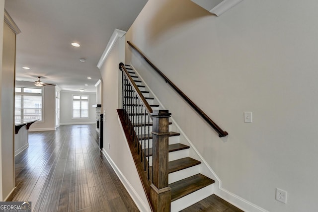 stairs featuring wood finished floors, baseboards, recessed lighting, and ceiling fan