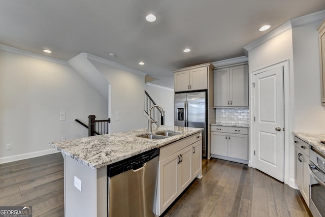 kitchen featuring a sink, recessed lighting, appliances with stainless steel finishes, and crown molding