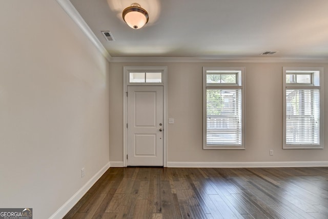entrance foyer with dark wood finished floors, visible vents, crown molding, and baseboards