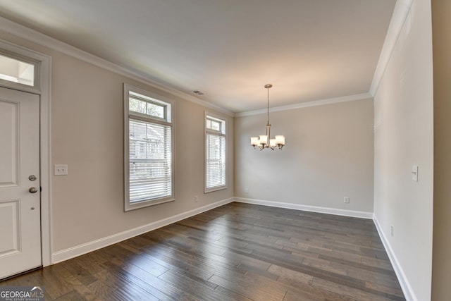 foyer with visible vents, an inviting chandelier, ornamental molding, and dark wood-style flooring